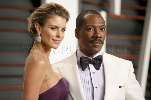 Comedian Eddie Murphy and Paige Butcher arrive at the 2015 Vanity Fair Oscar Party in Beverly Hills